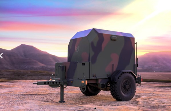 MilBESS 100 enclosure on a tactical trailer in woodland camouflage